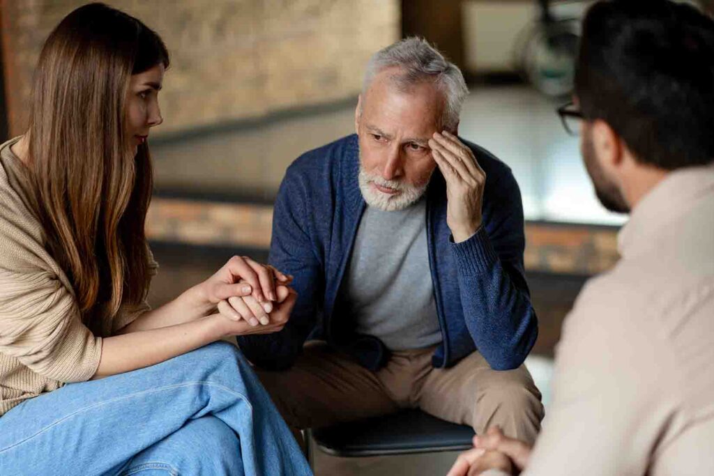 Family members talking to their dad about drug rehab