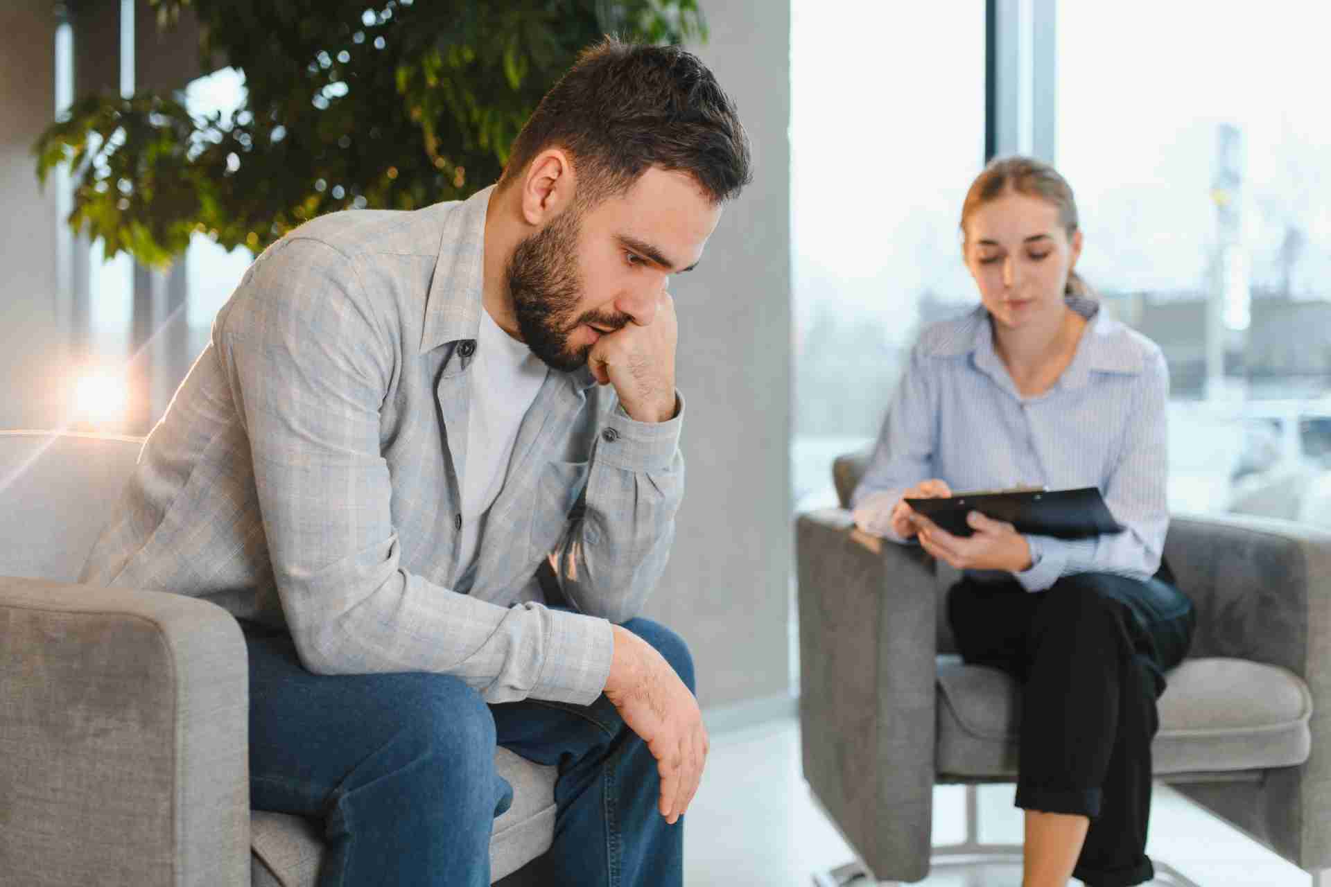 Individual receiving counseling support for depression during a mental health therapy session